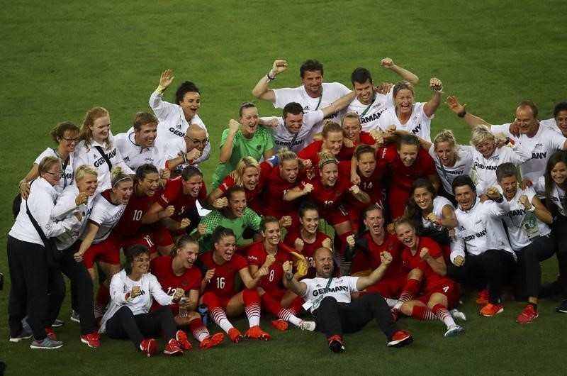 2016 Rio Olympics- Soccer- Final- Women's Football Tournament Gold Medal Match- Sweden v Germany- Maracana- Rio de Janeiro Brazil- 19/08/2016. Germany's players and coaching staff celebrate their gold medal win. REUTERS  Leonhard Foeger