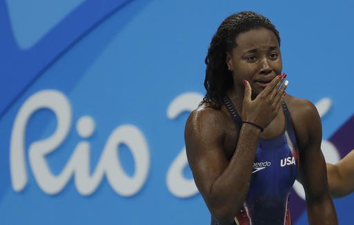 United States Simone Manuel wins the gold medal setting a new olympic record in the women's 100-meter freestyle during the swimming competitions at the 2016 Summer Olympics Thursday Aug. 11 2016 in Rio de Janeiro Brazil