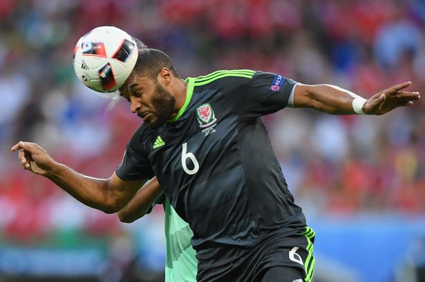 Ashley Williams of Wales heads the ball