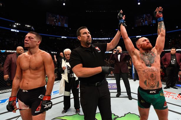 Conor Mc Gregor of Ireland celebrates his win over Nate Diaz in their welterweight bout during the UFC 202