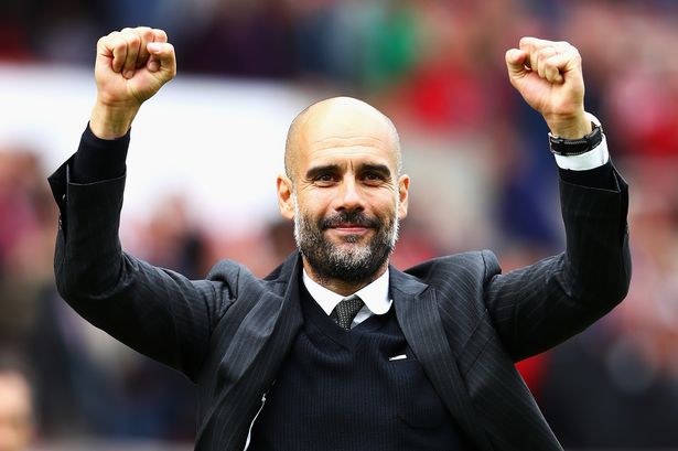 Pep Guardiola celebrates his sides win during the Premier League match between Stoke City and Manchester City