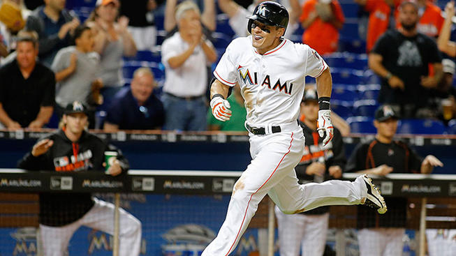 Getty Images Derek Dietrich hit a pinch-hit triple in the ninth