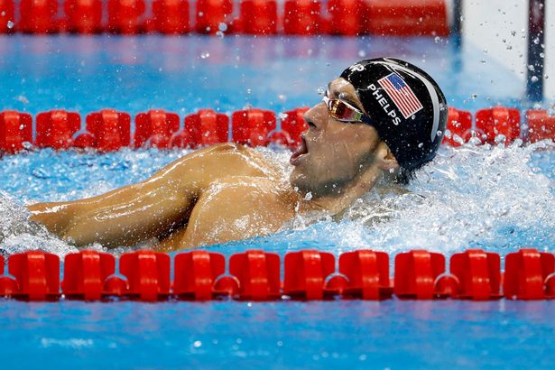 Michael Phelps competes in the Men's 200m Individual Medley Final