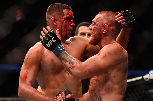 Nate Diaz shakes hands wih Conor Mc Gregor of Ireland at the completion of their welterweight bout during the UFC 202