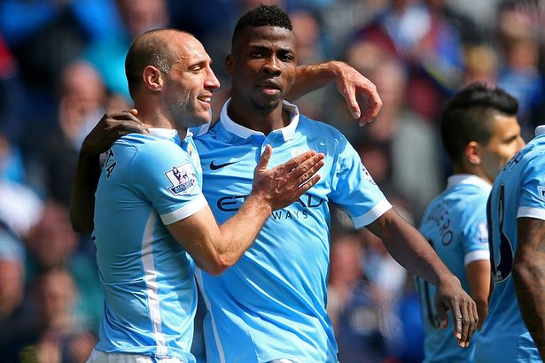 Kelechi Iheanacho celebrates with Pablo Zabaleta after scoring the third goal