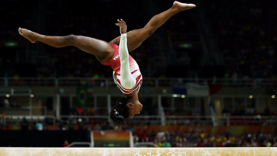 Simone Biles of the United States competes on the balance beam during the Artistic Gymnastics Women's Team Final on Day 4 of the Rio 2016 Olympic Games at the Rio Olympic Arena