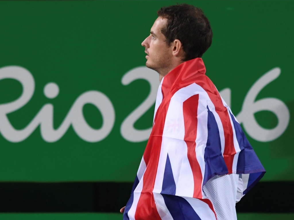 Gold medallist Andy Murray poses during the podium ceremony of the men's singles gold medal tennis event at the Olympic Tennis Center in Rio on Sunday