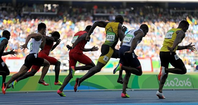 Jamaica's Usain Bolt center competes in a men's 100-meter heat during the athletics competitions of the 2016 Summer Olympics at the Olympic stadium in Rio de Janeiro Brazil Saturday Aug. 13 2016