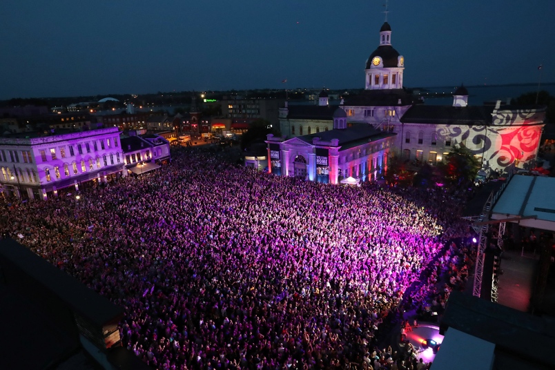 People who could not get a ticket gather in Springer Market square to listen to the Tragically Hip in downtown Kingston Ontario Aug. 20. The Tragically Hip mixed fan favorites newer songs and some politics on Saturday night during the final show of the