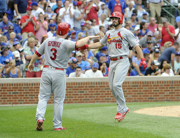 St. Louis Cardinals Randal Grichuk right is greeted by Jedd Gyorko after hitting a grand slam against the Chicago Cubs during the eighth inning of a