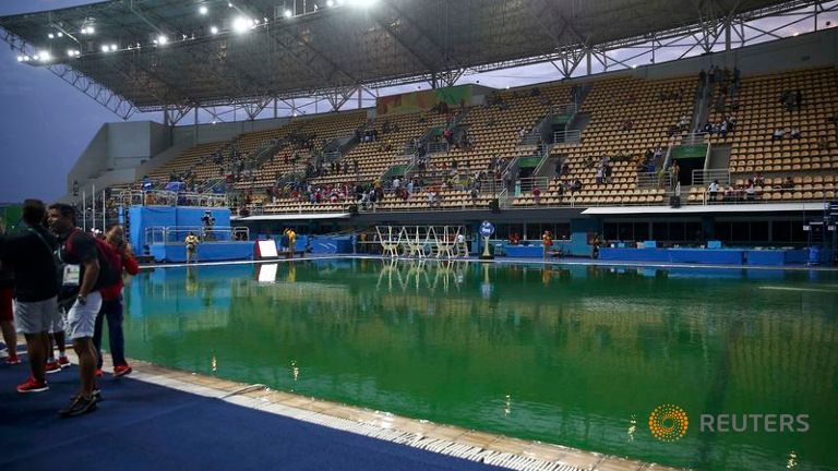 Olympics-Diving-Swimming pool's green hue stokes puzzlement