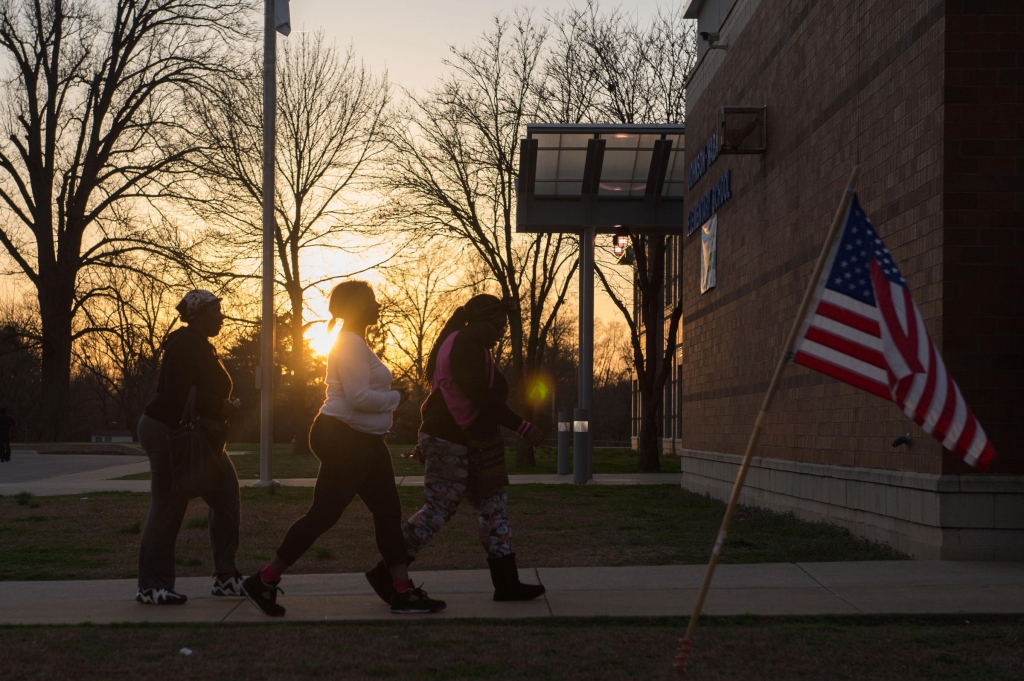 Voters arrive to cast their vote during Missouri primary voting at Johnson Wabash Elementary School