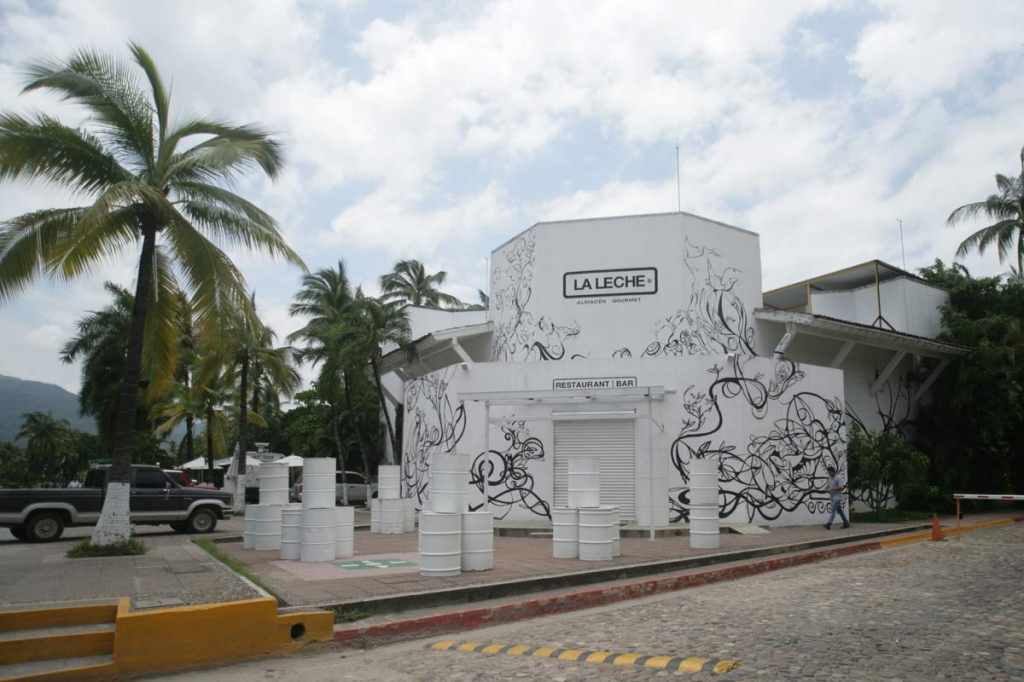 The entrance of the restaurant'La Leche stands closed after armed men abducted as many as 16 people who were dining in the upscale restaurant in Puerto Vallarta Mexico Monday Aug. 15 2016