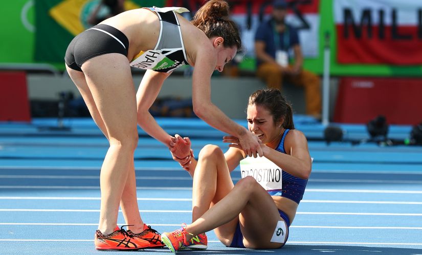 Hamblin helping D'Agostino with her ankle injruy