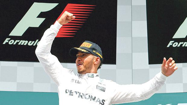 Lewis Hamilton reacts on the podium at Hockenheim