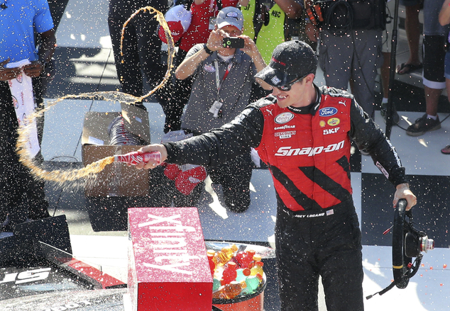 Joey Logano celebrates in Victory Lane after winning the NASCAR Xfinity series auto race at Watkins Glen International Saturday Aug. 6 2016 in Watki