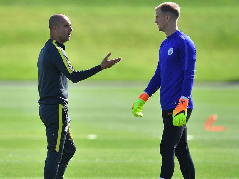 Pep Guardiola with Joe Hart at training on Tuesday