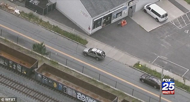 A hatchet-waving man led police on a 20-mile chase through several Massachusetts towns before eventually being boxed in by state and local police cruisers officials said