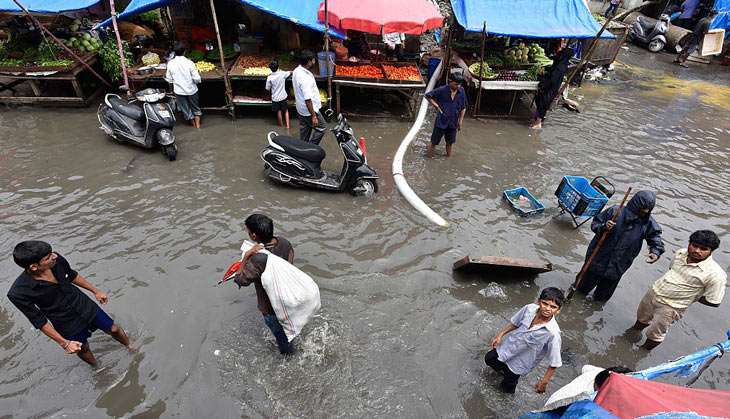 Heavy rains bring Mumbai to a standstill. IMD predicts showers over the weekend