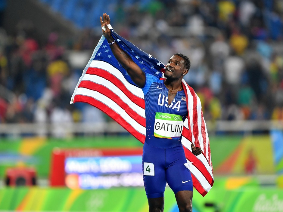 Justin Gatlin of the United States waves to the crowd after finishing second in the men's 100-metre relay in Rio on Sunday