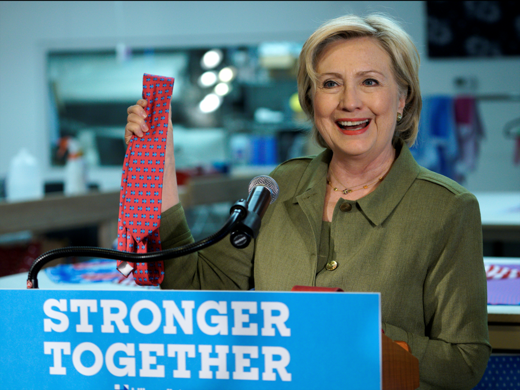 Hillary Clinton holds one of Donald Trump's ties during an event in Denver Colorado. The tie was manufactured in China.   REUTERS  Rick Wilking