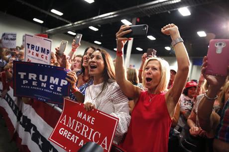 Supporters cheer as Republican presidential candidate Donald Trump arrives to speak at a campaign rally in Fredericksburg Va. Saturday Aug. 20 2016