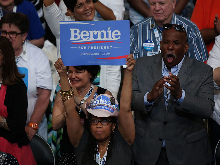 A delegate holds a campaign sign in support of Sen. Bernie Sanders I-Vt. during the Democratic National Convention in Philadelphia