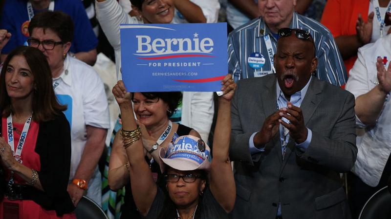 A delegate holds a campaign sign in support of Sen. Bernie Sanders I-Vt. during the Democratic National Convention in Philadelphia