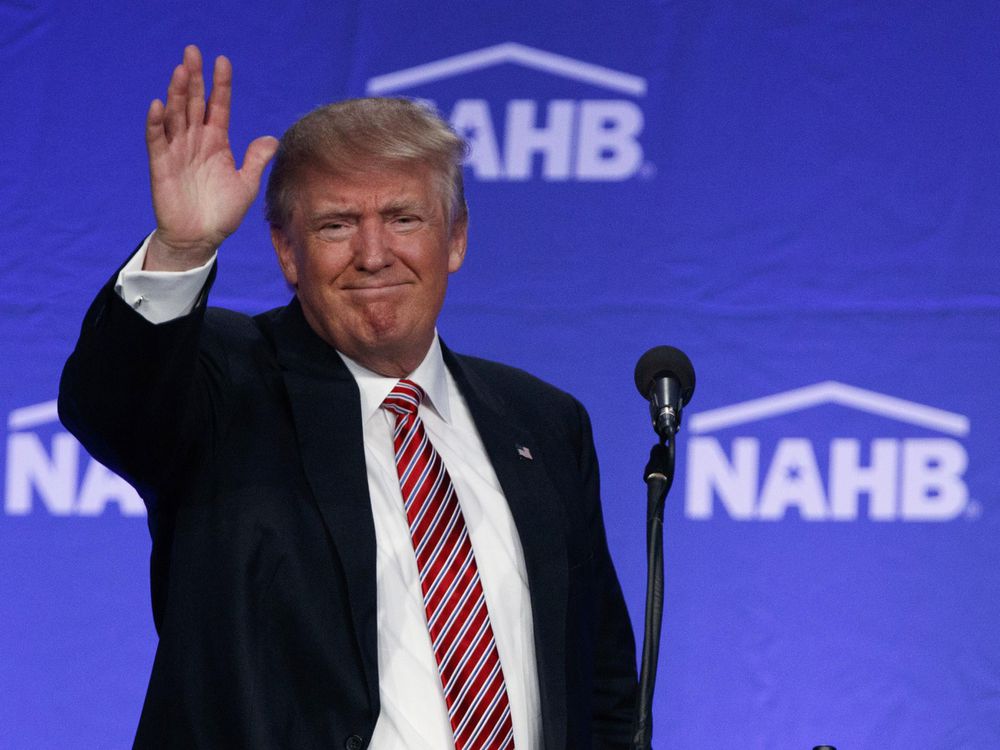 Republican presidential candidate Donald Trump waves after speaking to the National Association of Home Builders Thursday Aug. 11 2016 in Miami Beach Fla