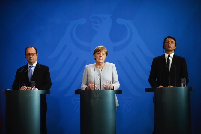 German Chancellor Angela Merkel, the Prime Minister of Italy Matteo Renzi, and the President of France Francois Hollande brief the media during a meeting at the chancellery in Berlin