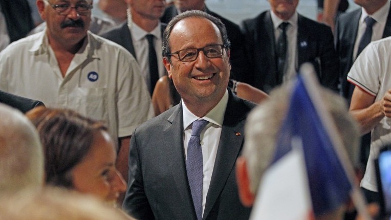 French President Francois Hollande meets the public after unveiling a plaque for the start of the enlargement works of the A9 highway in Rivesaltes southern France