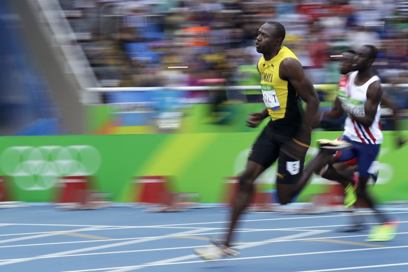 Jamaica's Usain Bolt competes in a men's 200-meter heat during the athletics competitions of the 2016 Summer Olympics at the Olympic stadium in Rio de Janeiro Brazil Tuesday Aug. 16 2016