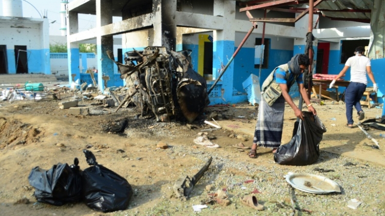 Yemeni workers clean at a hospital operated by Doctors Without Borders