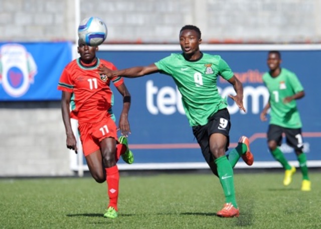 Damiano Kalo of Zambia challenged by Anthony Msisya of Malawi during the 2016 Cosafa Cup match between Zambia and Malawi at Saint Francois Xavie Port Louis Mauritius on 24 July 2016. BackpagePix