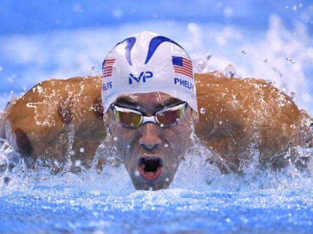 USA's Michael Phelps competes in a Men's 200m Butterfly heat during the swimming event at the Rio 2016 Olympic Games at the Olympic Aquatics Stadium in Rio de Janeiro