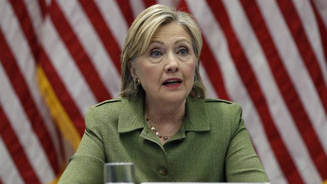 Democratic presidential candidate Hillary Clinton talks with media as she meets with law enforcement leaders at John Jay College of Criminal Justice in New York Thursday Aug. 18 2016