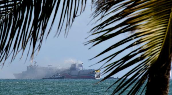 Smokes spills from the cruise ship Caribbean Fantasy off the coast of San Juan Puerto Rico Aug. 17 2016