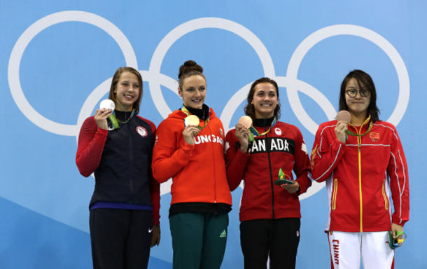 Baker with her silver medal Hosszu with her gold medal Canada's Kylie Masse and China's Yuanhui Fu with their bronze medals during the medal ceremony