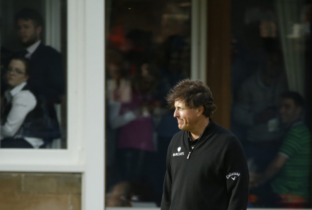 Phil Mickelson of the United States looks on as Henrik Stenson of Sweden receives the trophy for winning British Open Golf Championships at the Royal Troon Golf Club in Troon Scotland Sunday