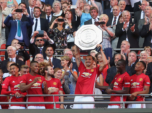 LONDON ENGLAND- AUGUST 07 Zlatan Ibrahimovic of Manchester United lifts the Community Shield trophy after the FA Community Shield match between Leicester City and Manchester United at Wembley Stadium