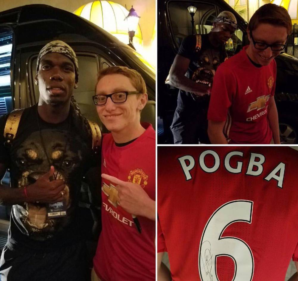 Pogba signs Manchester United shirt with his number