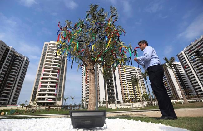 A tree filled with ribbons stands as part of a memorial in honor of Israeli Olympic athletes killed by Palestinian gunmen at the 1972 Munich Olympics in the Olympic Village ahead of the Summer Olympics in Rio de Janeiro Brazil Wednesday Aug. 3 2016