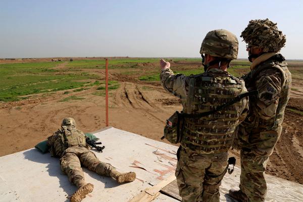 American and Spanish trainers use live ammunition in training exercises at Basmaya base 40 kilometers southeast of Baghdad Iraq