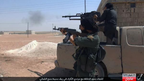 This online image posted July 18 shows Islamic State fighters firing their weapons during clashes with the Kurdish-led Syria Democratic Forces in Manbij in Aleppo province Syria