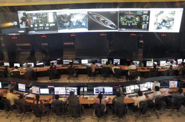 Indian Space Research Organization scientists and engineers monitor the movements of India's Mars orbiter at their Spacecraft Control Center in the southern Indian city of Bangalore