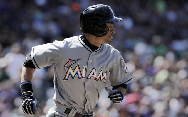 ASSOCIATED PRESS           Miami Marlins’ Ichiro Suzuki runs to first base on a ground out in the third inning of a baseball game against the Colorado Rockies in Denver on Sunday Aug. 7 2016. Suzuki is one hit away from 3,00