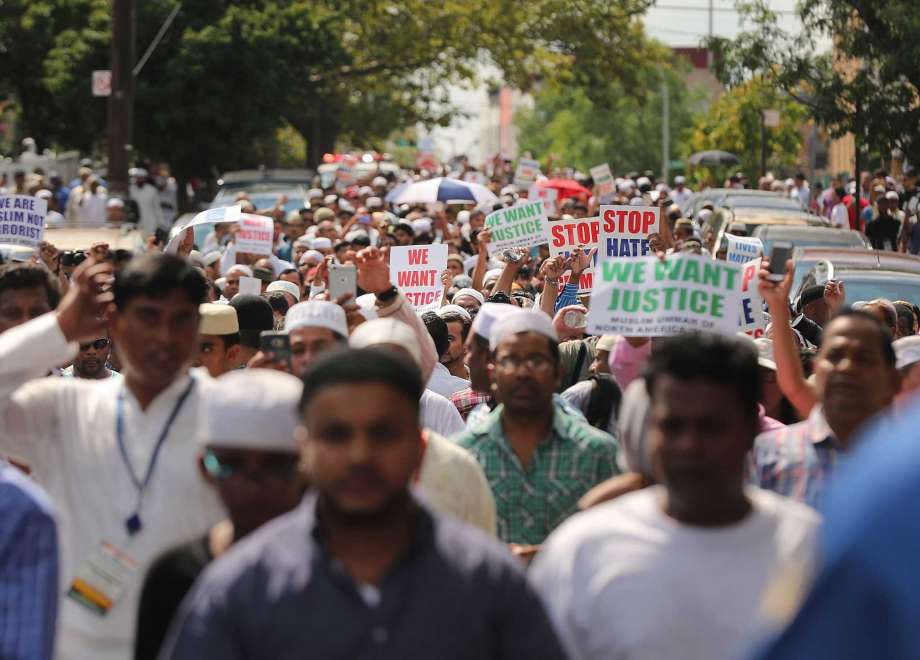 NEW YORK NY- AUGUST 15 People march after a mass prayer for Imam Maulama Akonjee and his assistant Thara Uddin 64 who died in a fatal shooting outside of the Al Furqan Jame Masjid mosque on August 13 in the Queens borough of New York on August 15