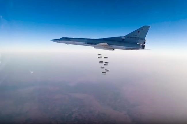 In this frame grab from video provided by the Russian Defence Ministry Press Service Russian long range bomber Tu-22 M3 flies during a strike above an undisclosed location in Syria on Sunday Aug. 14 2015. ( Russian Defence Ministry press service