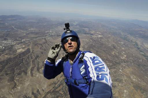 Skydiver makes final preparations to jump without parachute