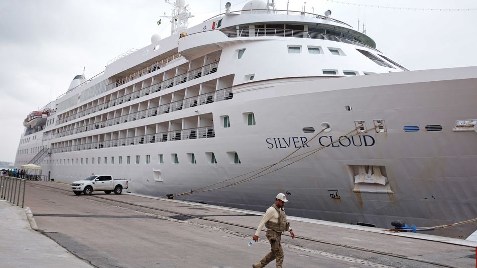 A federal police officer walks past the the Silver Cloud cruise ship before the U.S. men's basketball team arrives on Wednesday